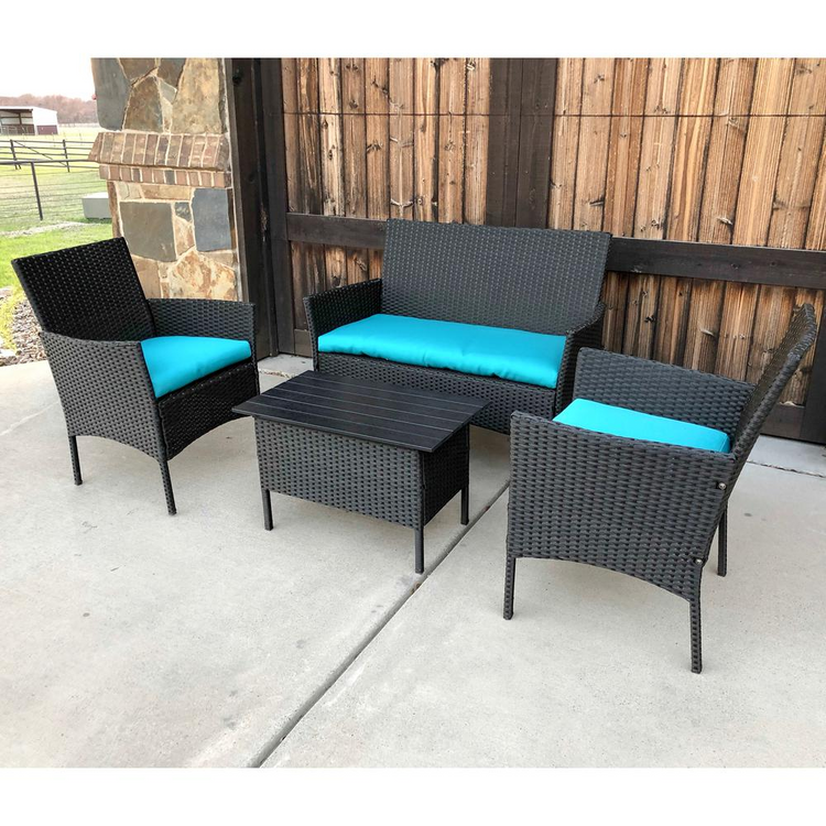 a patio furniture with blue cushions