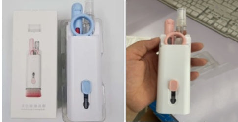 a hand holding a device