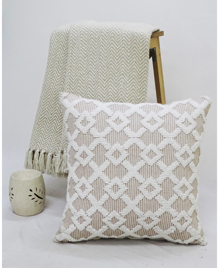 a pillow and blanket on a stool