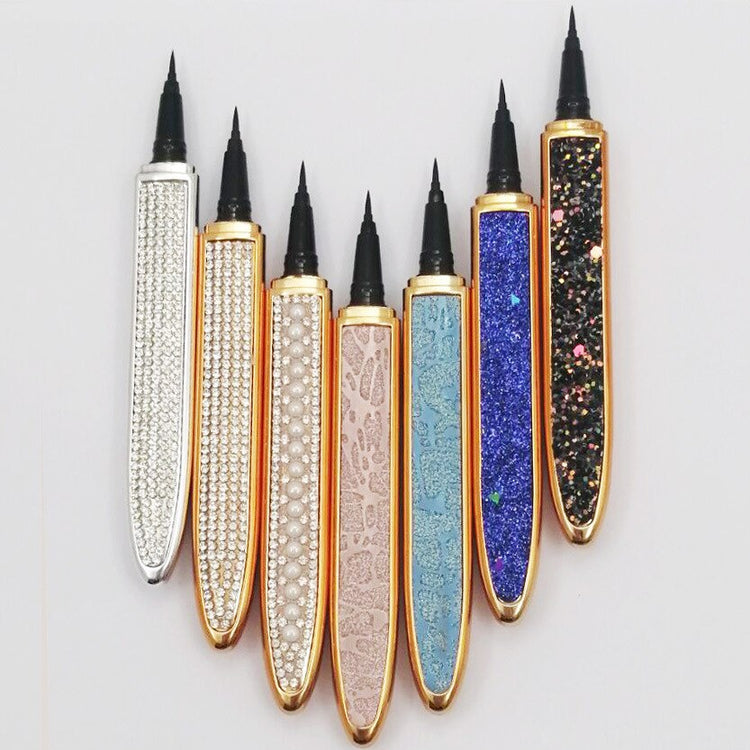 a group of pens with black tips
