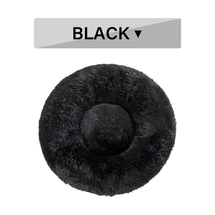 a black round pillow with a circle
