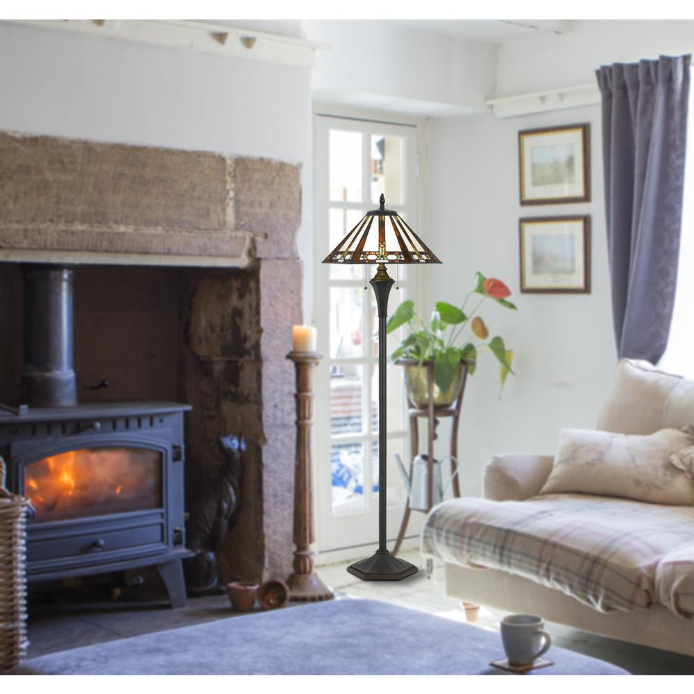 a living room with a fireplace and a lamp