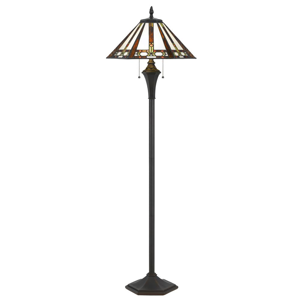 a tall lamp with a stained glass shade