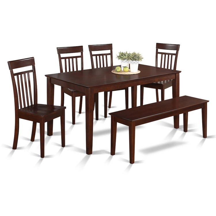 a table and chairs with a vase of flowers on it