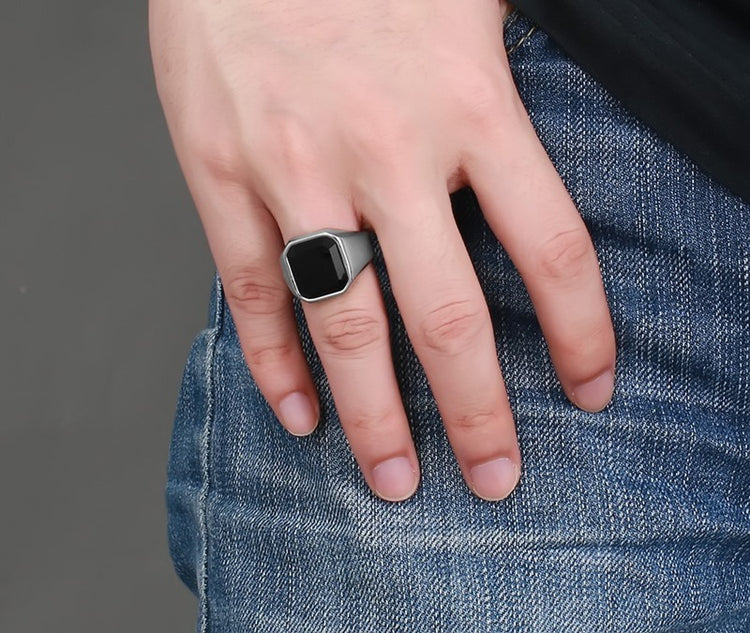 a hand with a ring on a finger
