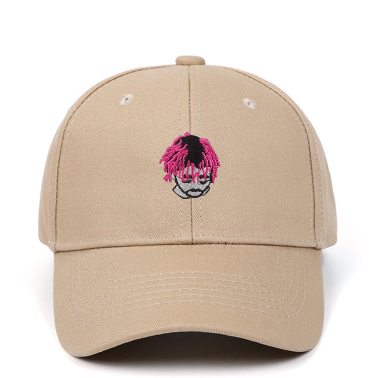 a beige hat with pink hair on it