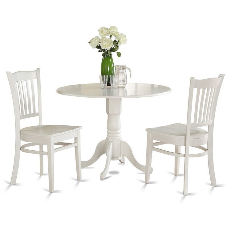a white table with white chairs and a vase of flowers