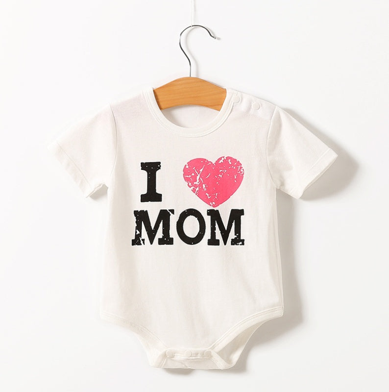 a white baby shirt with a pink heart on it