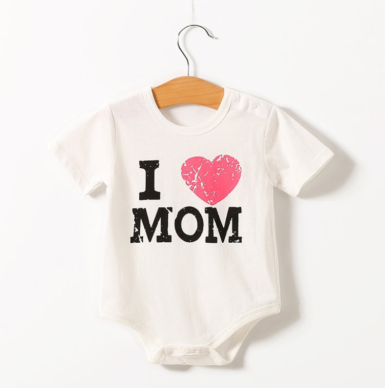 a white baby shirt with a pink heart on it