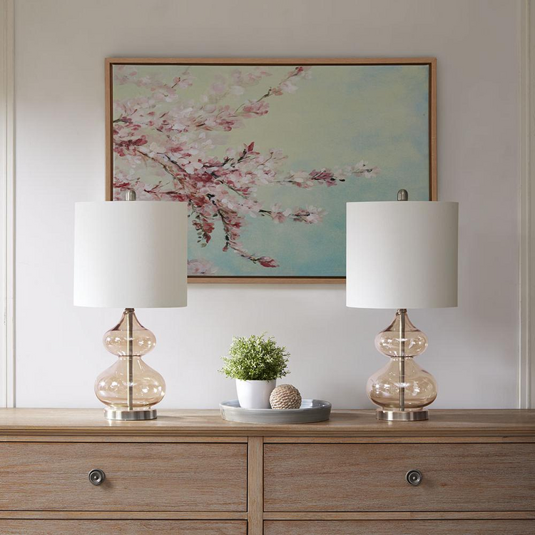a table with two lamps on it