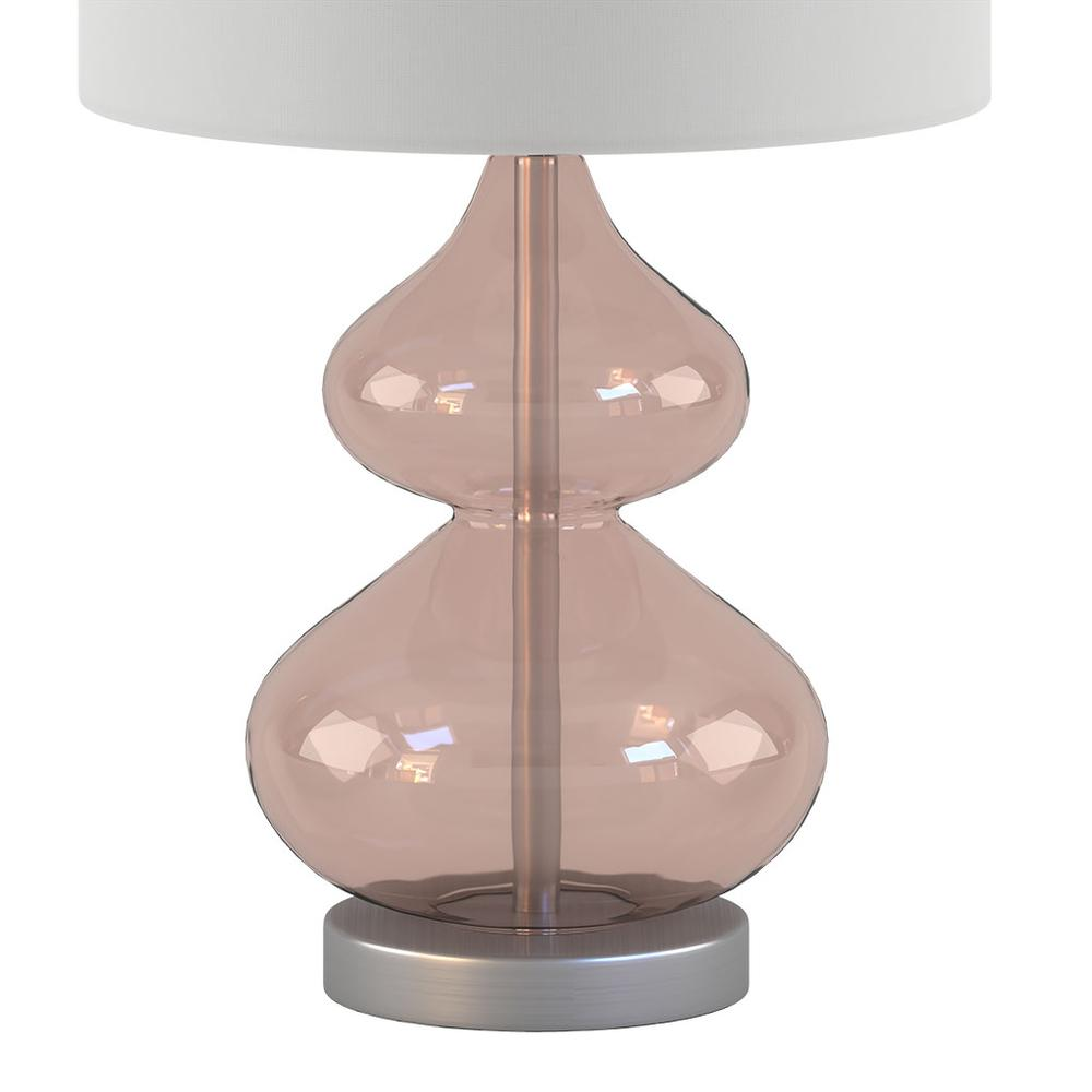 a pink glass lamp with a white shade