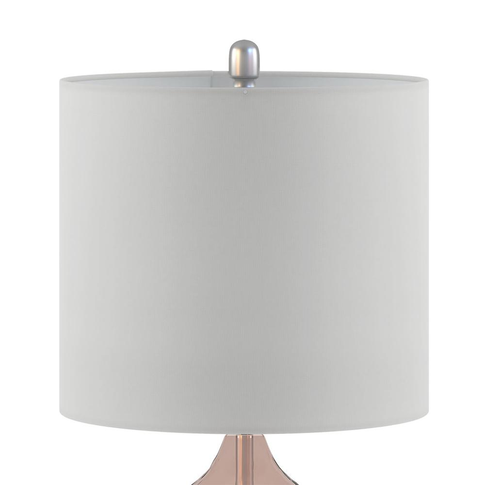 a white lamp shade with a pink base