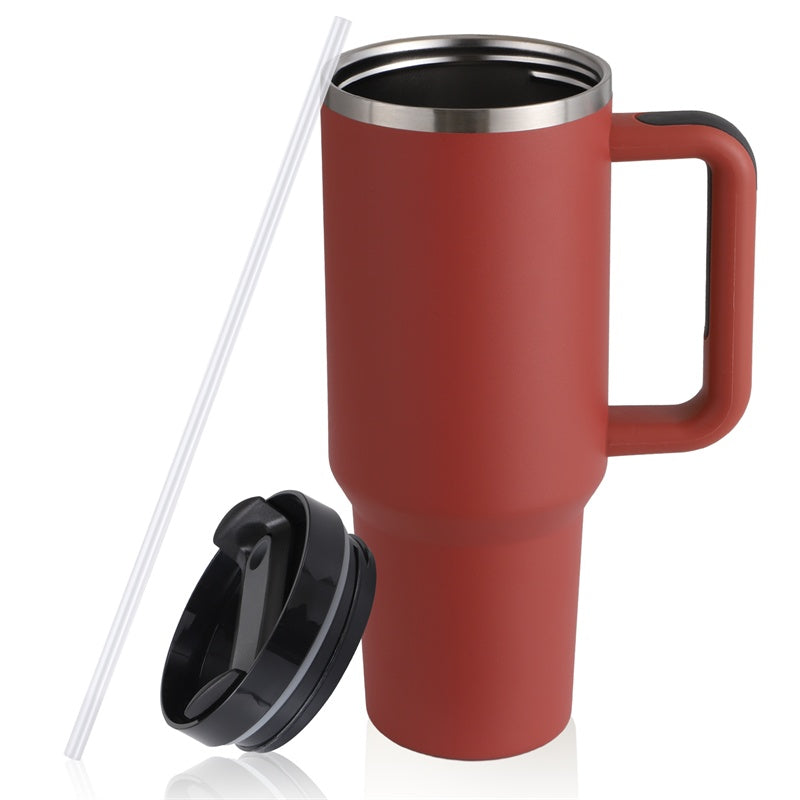 a red coffee mug with a straw