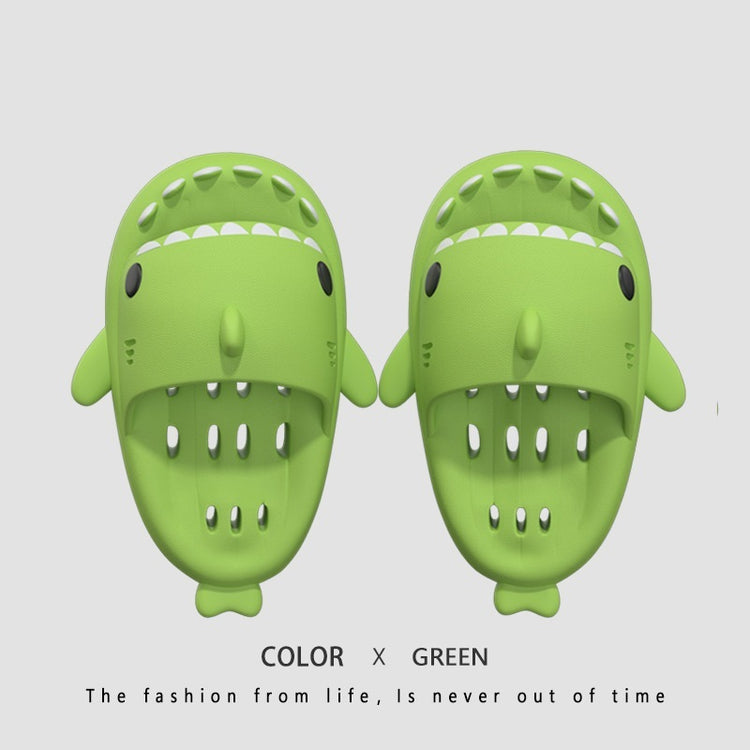 a pair of green shoes with teeth