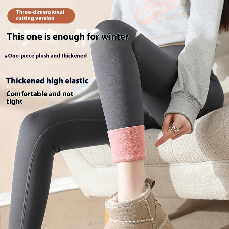 a woman sitting on a chair wearing leggings