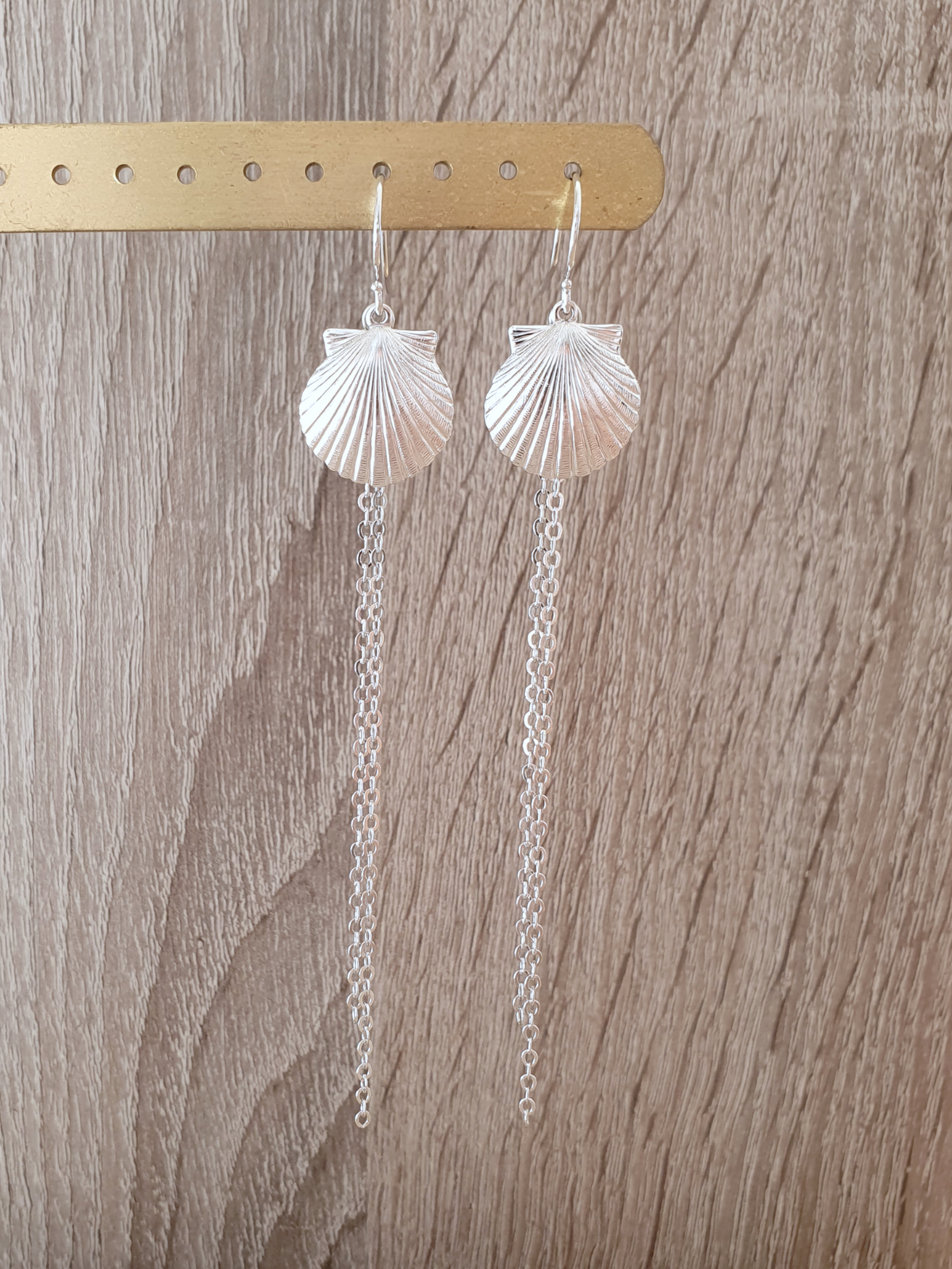 a pair of earrings on a bar
