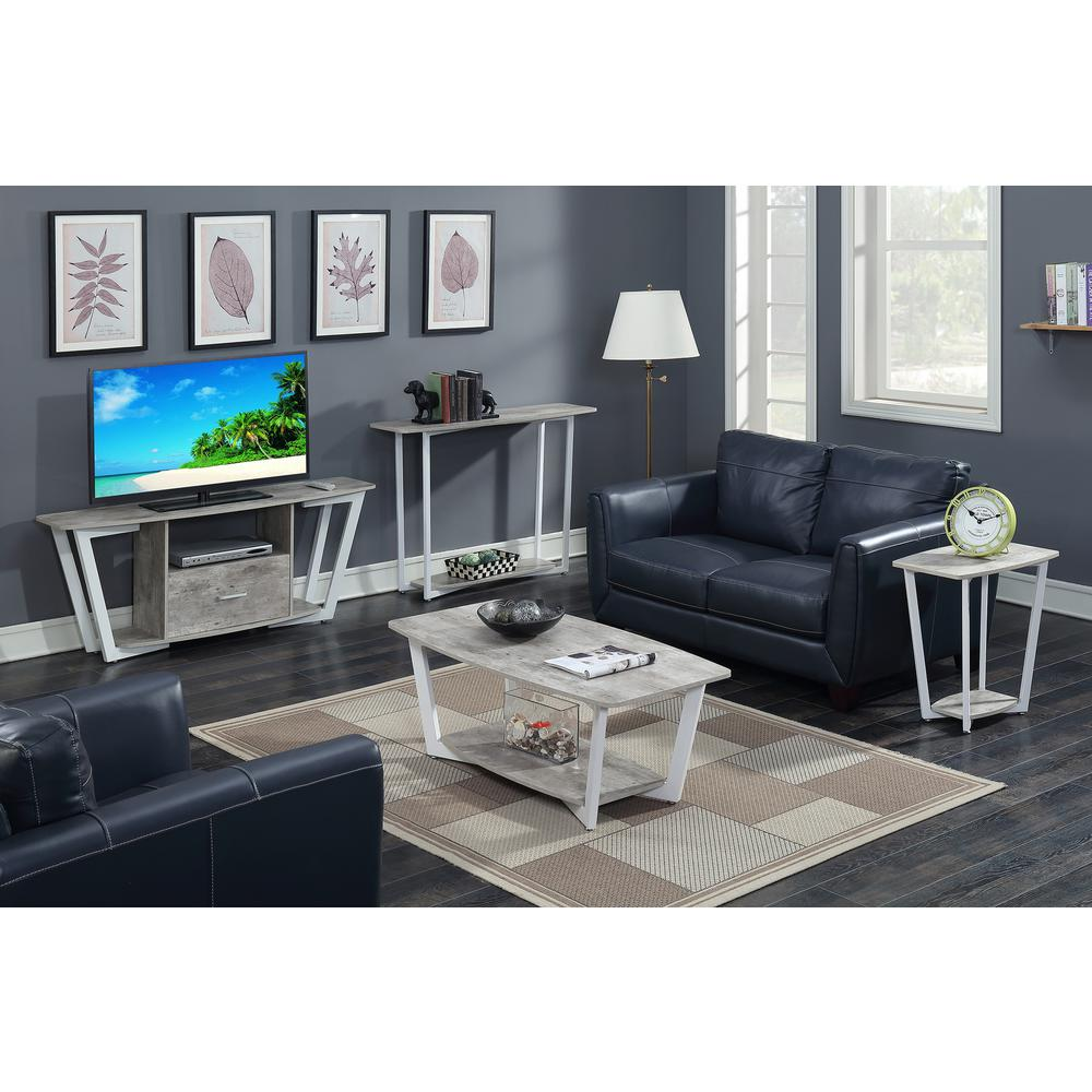 a living room with a tv and couches