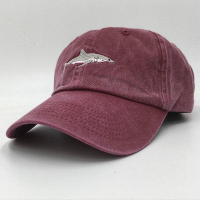 a red hat with a shark on it