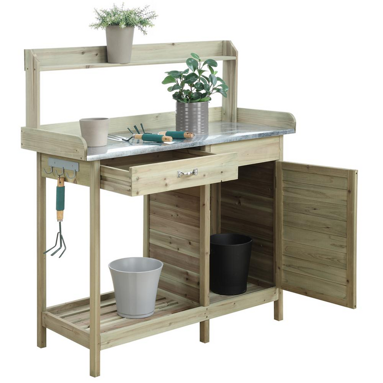 a wooden potting table with plants and tools