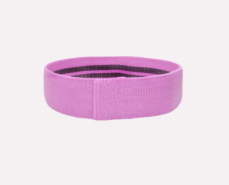 a pink elastic band on a white background