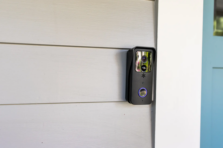 a black electronic device on a white wall