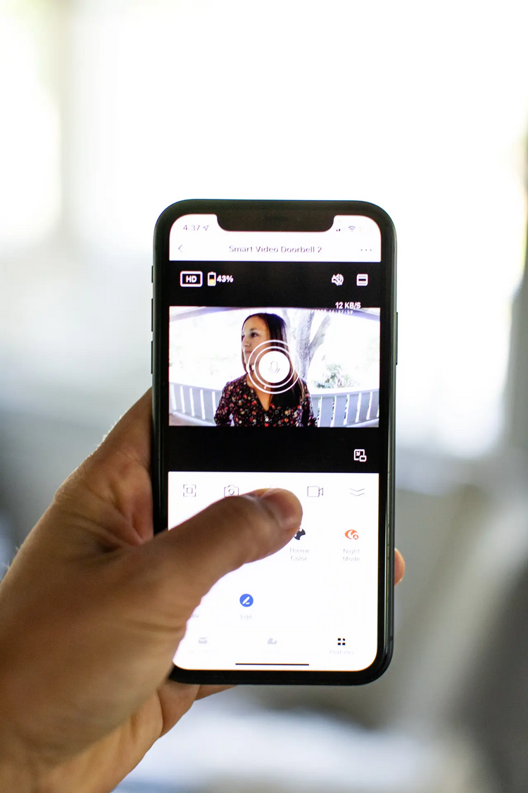 a hand holding a cell phone
