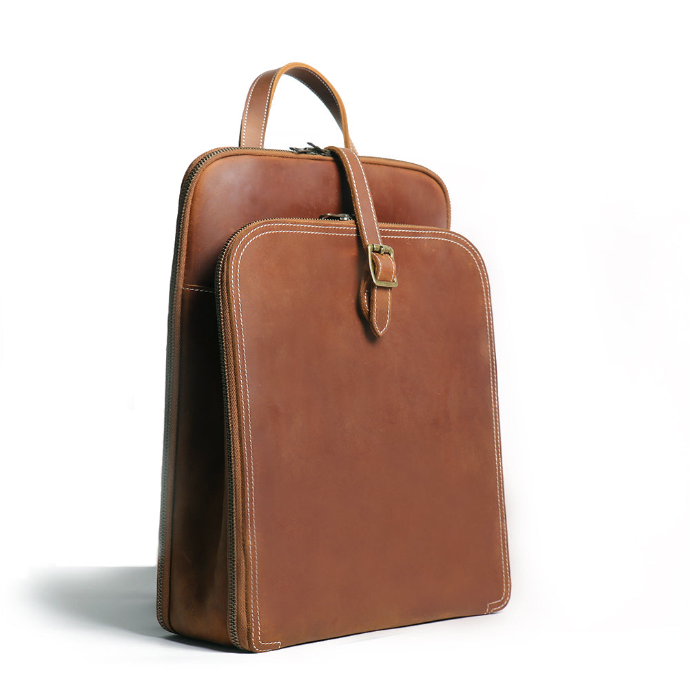 a brown leather bag with a strap