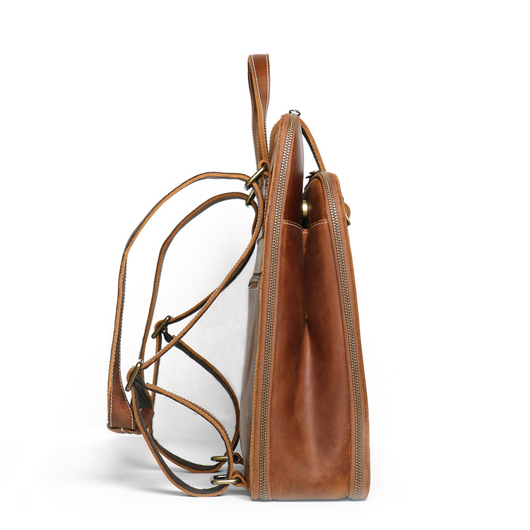 a brown leather bag with a strap