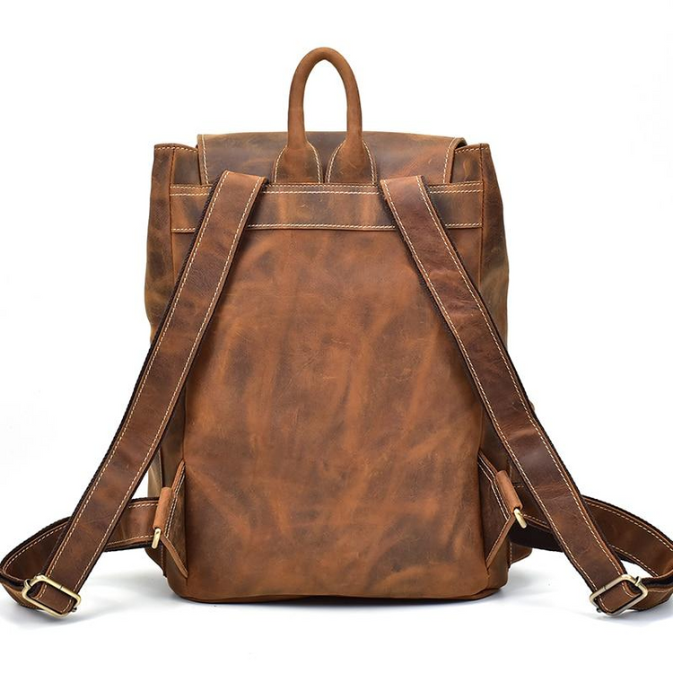 a brown leather backpack with straps