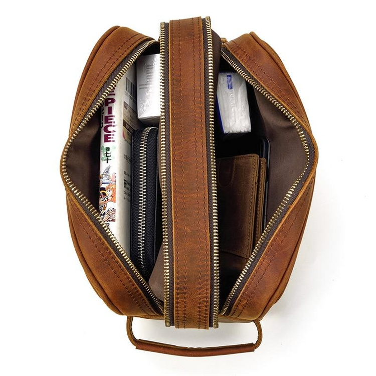 a brown bag with a zipper and objects inside