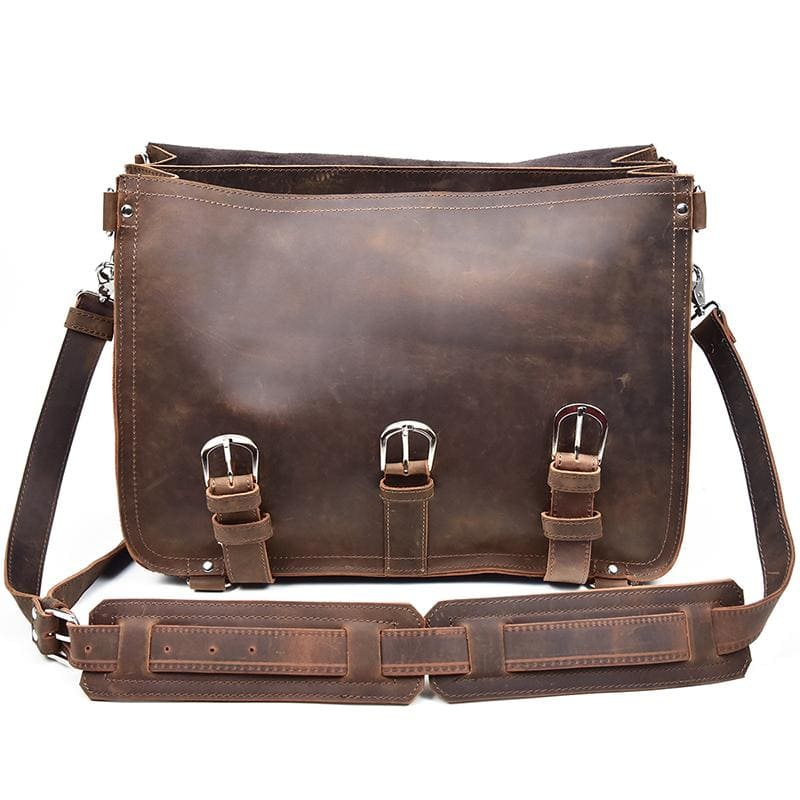 a brown leather bag with straps