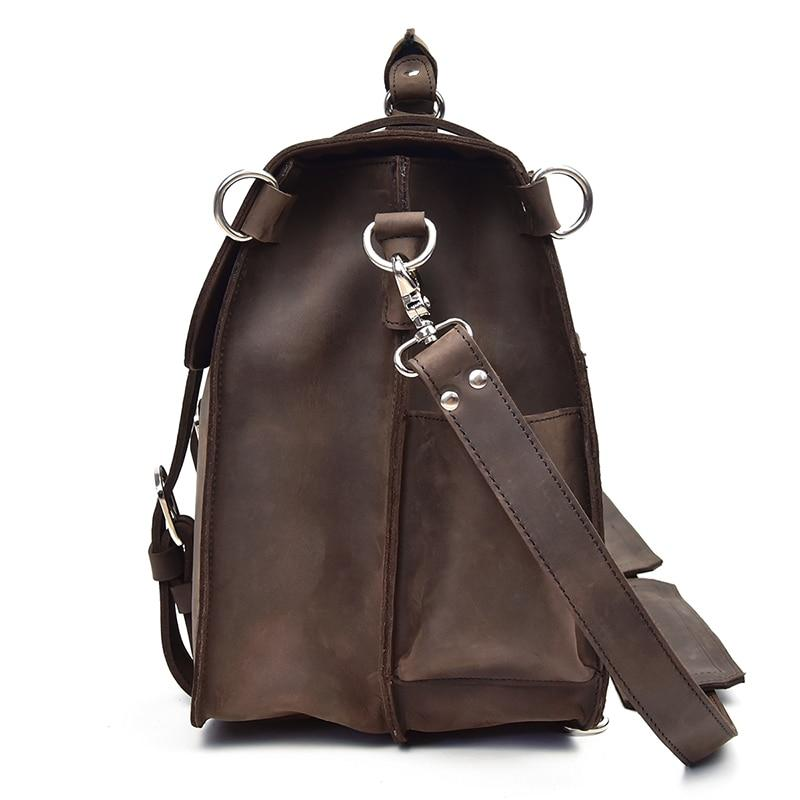 a brown leather bag with silver rings