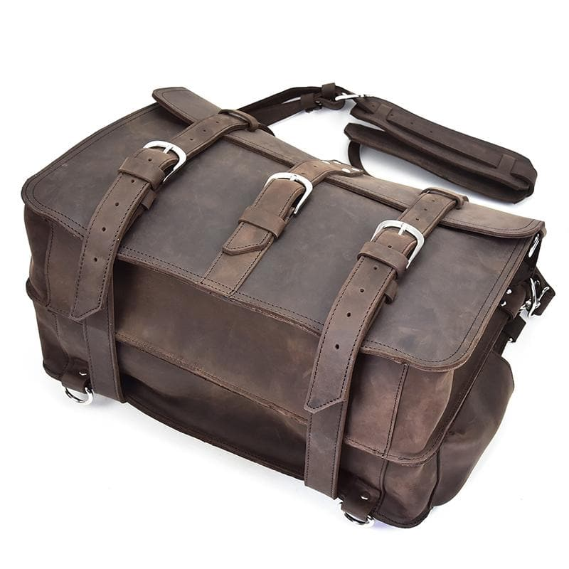 a brown leather bag with straps