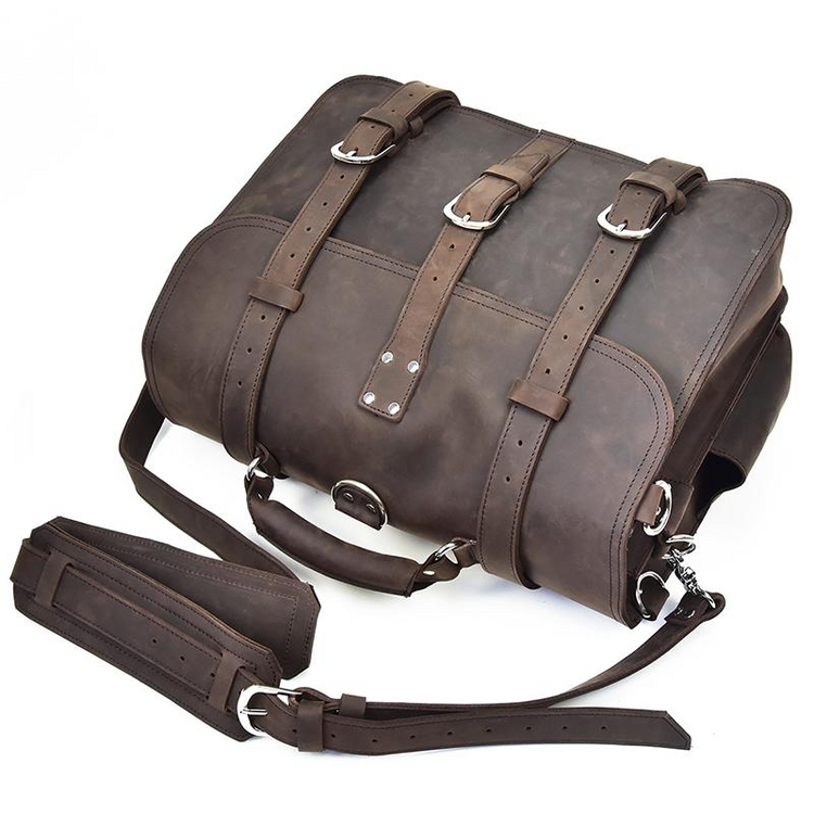 a brown leather bag with straps