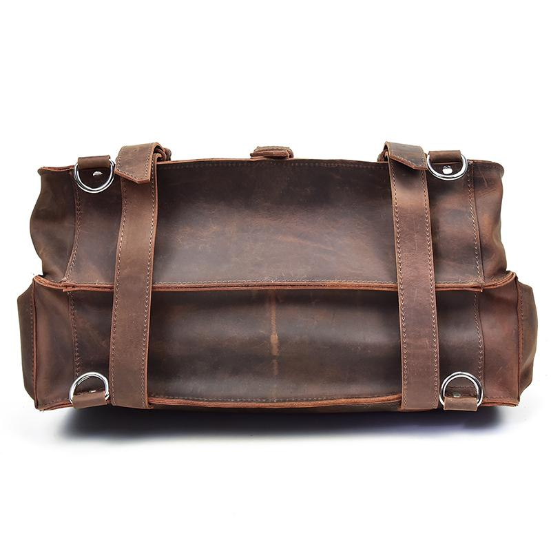 a brown leather bag with metal rings
