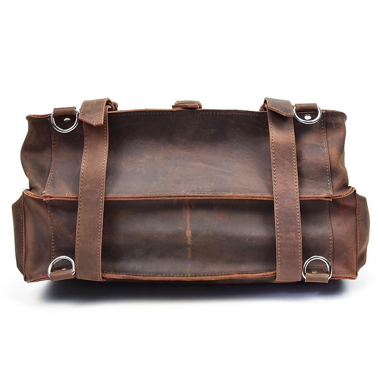 a brown leather bag with metal rings