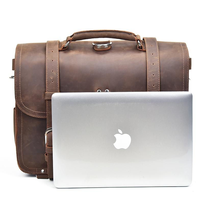 a brown leather bag with a silver laptop