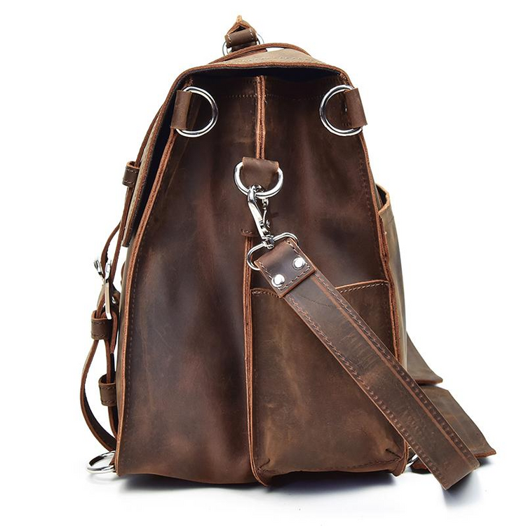 a brown leather backpack with straps