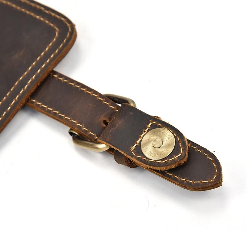 a brown leather strap with a gold logo