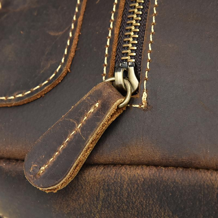 a zipper on a brown bag