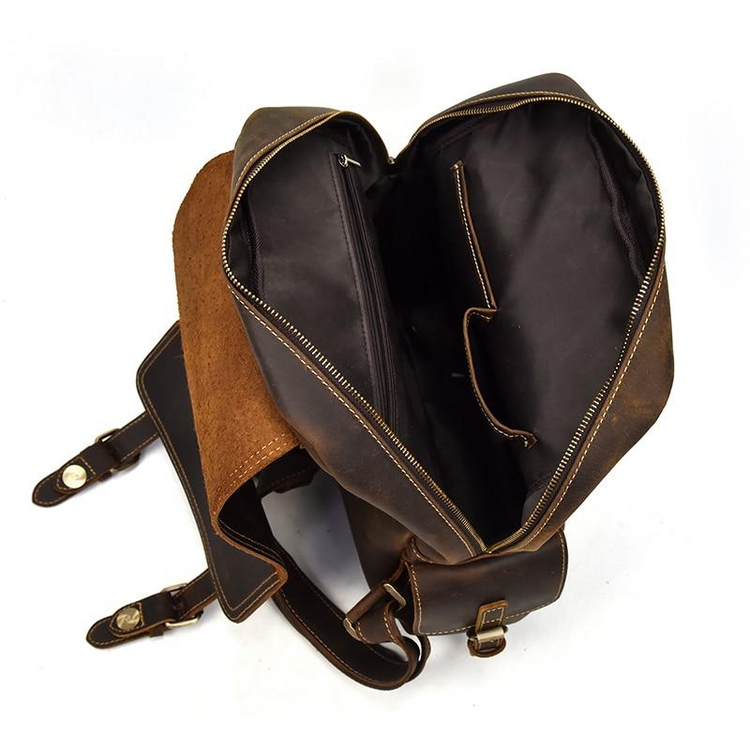 a brown leather bag with a brown leather strap