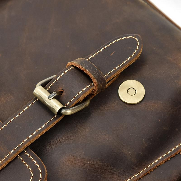 a close up of a brown leather bag