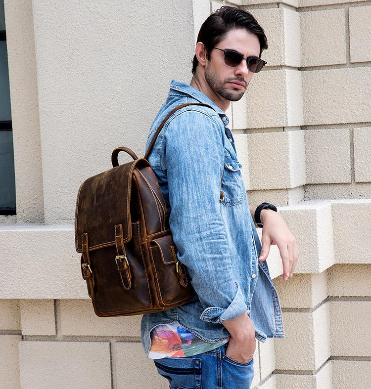 a man wearing sunglasses and a backpack