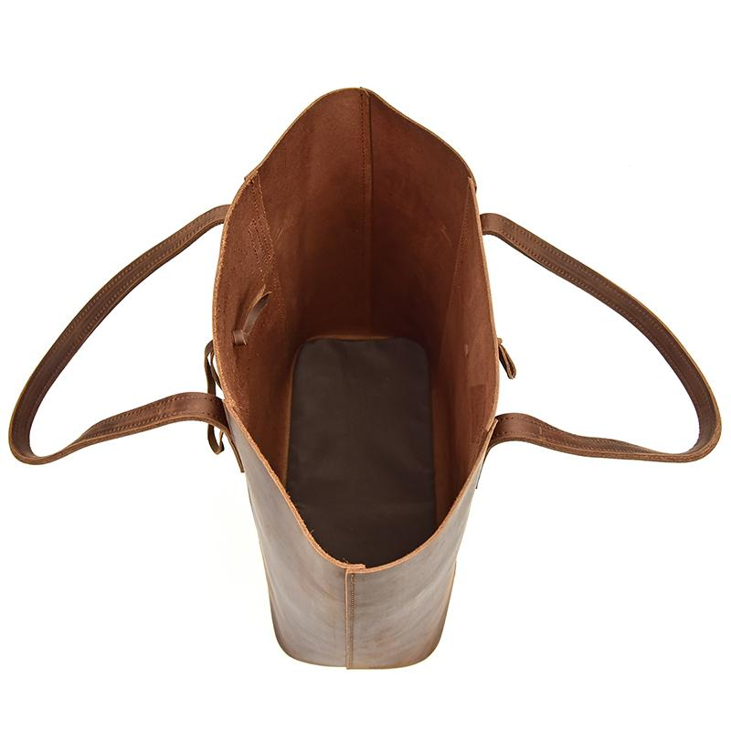 a brown leather bag with straps