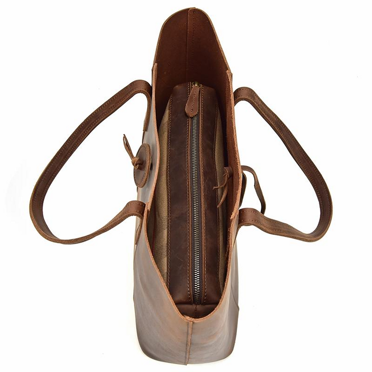 a brown leather bag with a zipper