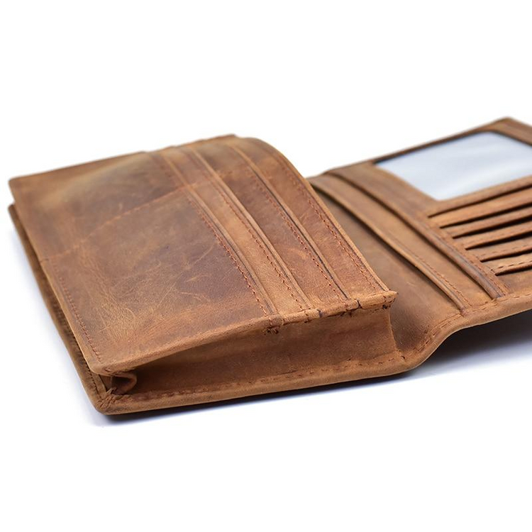 a brown leather wallet with a mirror