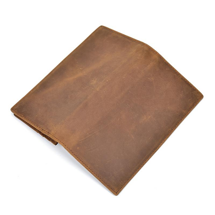 a brown leather wallet on a white background