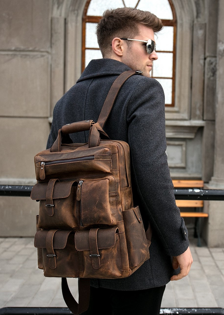 a man wearing sunglasses and a backpack