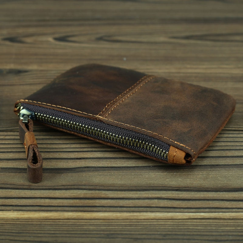 a brown wallet with a zipper