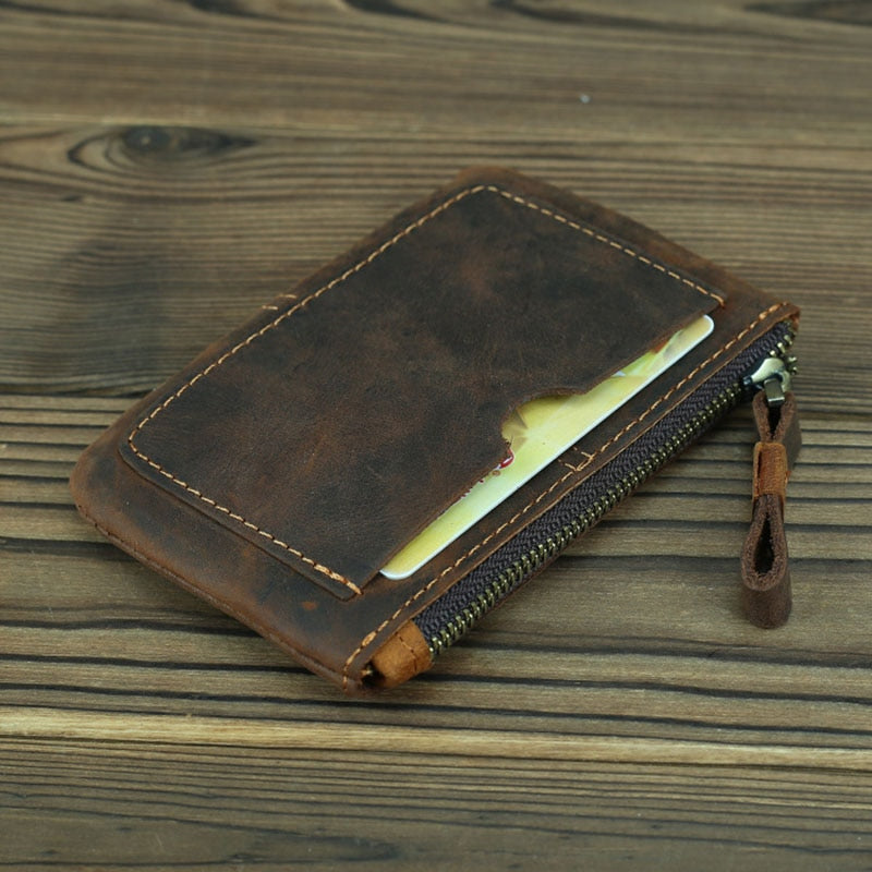 a brown wallet with a card inside
